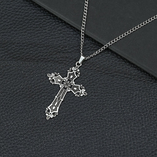 A beautifully crafted vintage-style cross necklace featuring intricate detailing and a timeless Christian design.