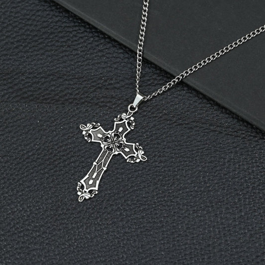A beautifully crafted vintage-style cross necklace featuring intricate detailing and a timeless Christian design.